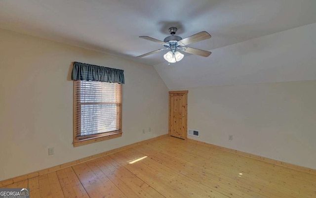 additional living space featuring ceiling fan, lofted ceiling, and light hardwood / wood-style floors