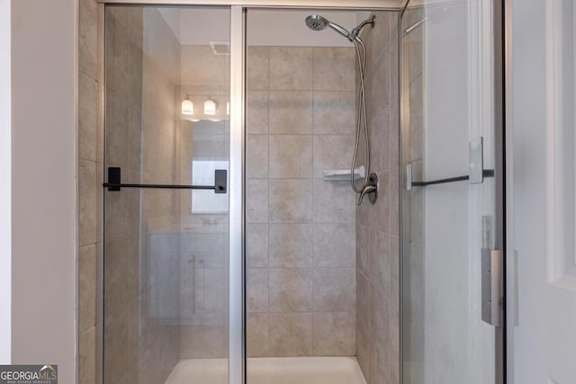 bathroom featuring an enclosed shower