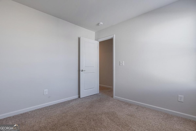 unfurnished room with carpet