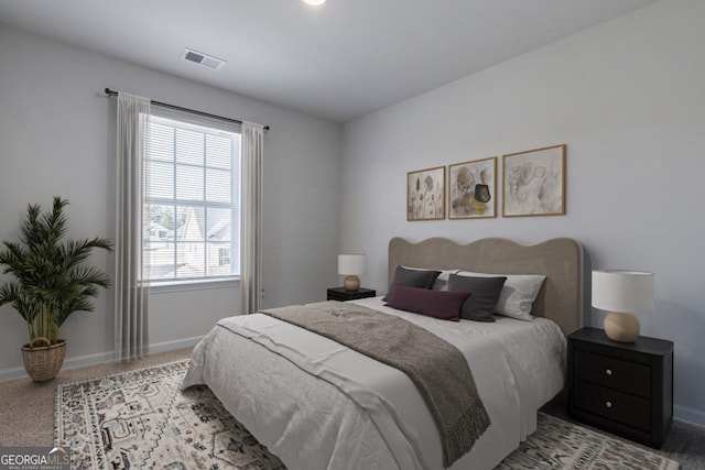 bedroom with light colored carpet