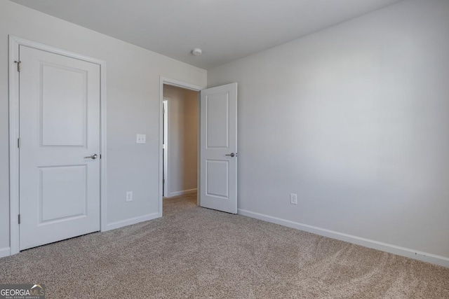 unfurnished bedroom featuring carpet floors