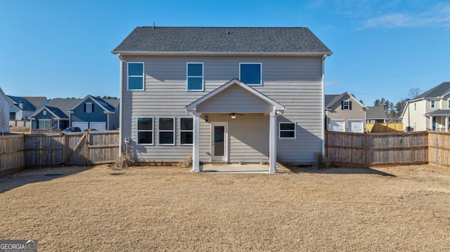 rear view of property featuring a patio and ceiling fan