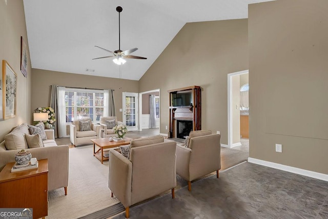 living room with ceiling fan and high vaulted ceiling