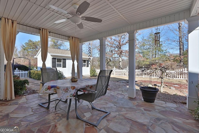 view of patio / terrace featuring an outdoor structure and ceiling fan