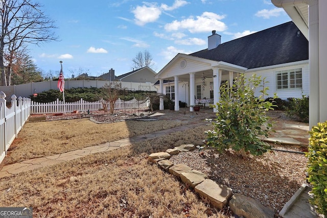 view of yard with covered porch