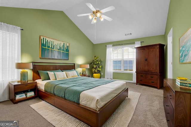 carpeted bedroom featuring high vaulted ceiling and ceiling fan