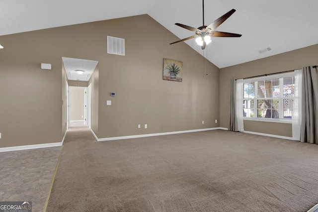 carpeted empty room featuring ceiling fan and high vaulted ceiling