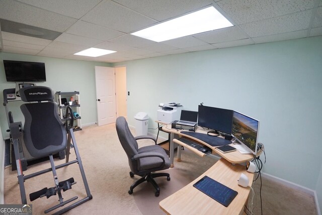 office space with a drop ceiling and light colored carpet