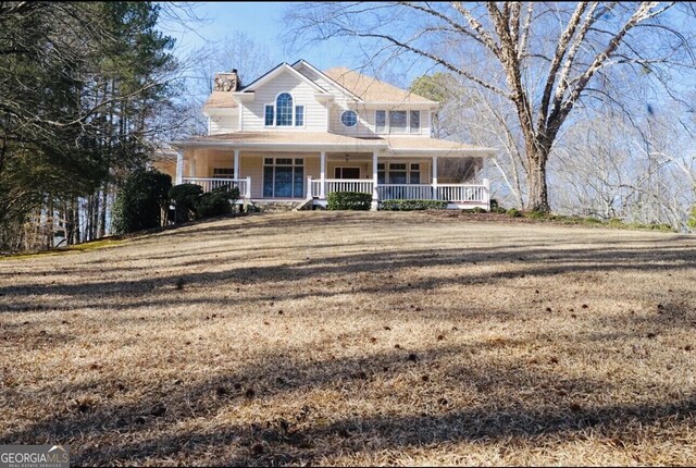 view of front of home with a front lawn and covered porch