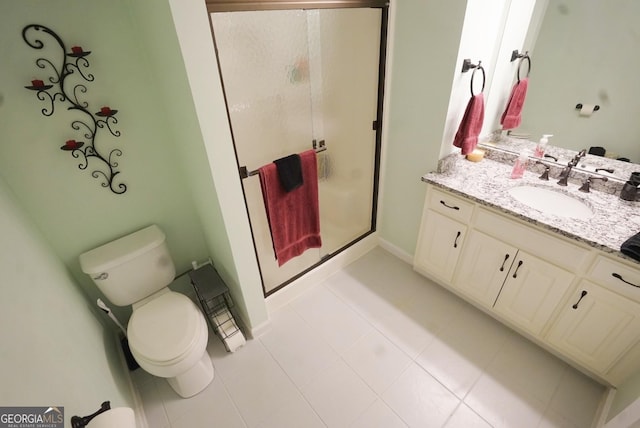 bathroom with vanity, toilet, and walk in shower