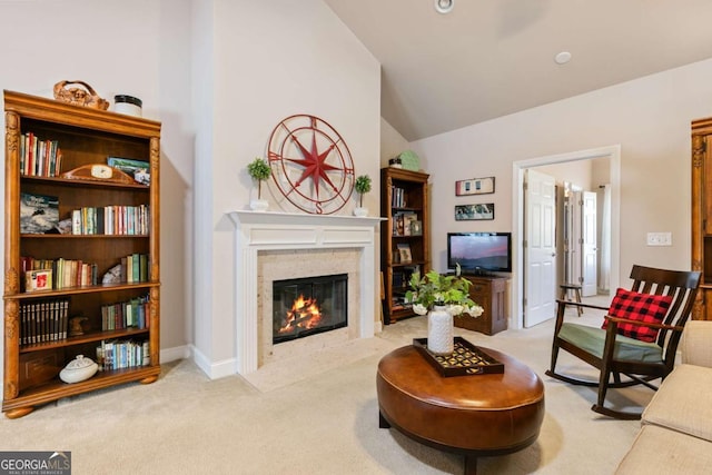 living room with lofted ceiling and light colored carpet