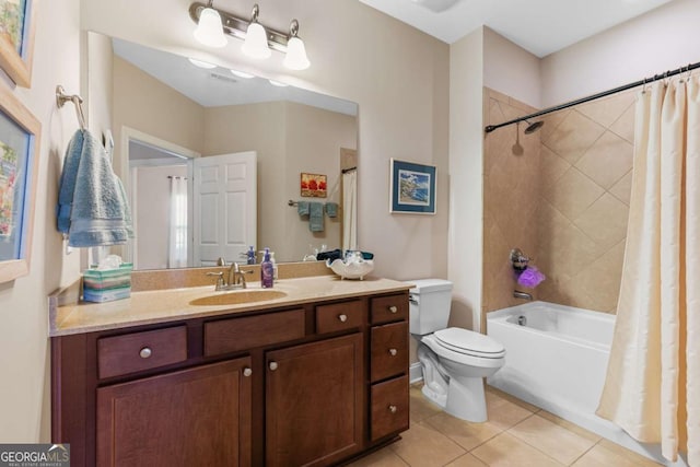 full bathroom featuring tile patterned flooring, vanity, toilet, and shower / tub combo with curtain