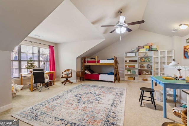 interior space with ceiling fan, carpet floors, and vaulted ceiling