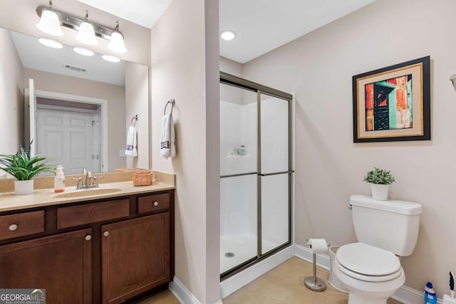 bathroom featuring vanity, toilet, and walk in shower