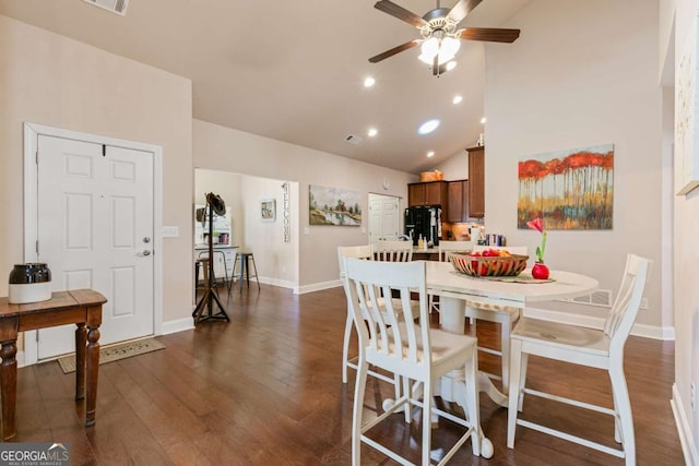 dining room featuring ceiling fan, dark hardwood / wood-style flooring, and high vaulted ceiling