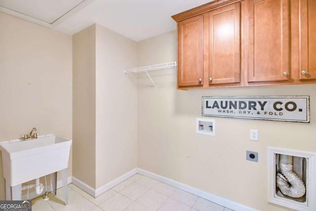 laundry room with sink, cabinets, light tile patterned floors, hookup for a washing machine, and electric dryer hookup