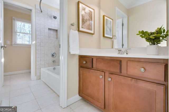 bathroom featuring vanity, tile patterned flooring, ornamental molding, and tiled shower / bath