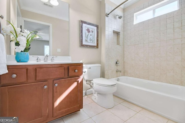 full bathroom with tile patterned flooring, tiled shower / bath combo, vanity, ornamental molding, and toilet