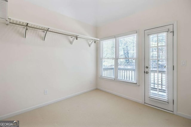 interior space with plenty of natural light and carpet