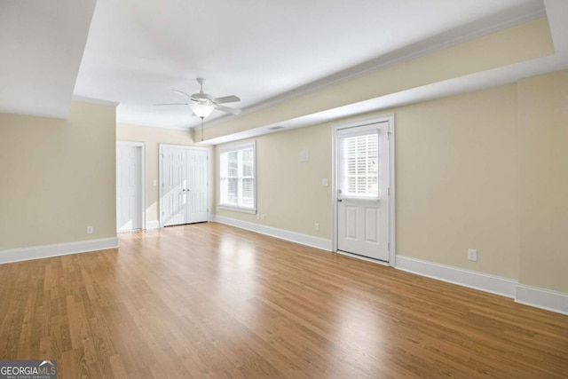 unfurnished room featuring ceiling fan and light wood-type flooring