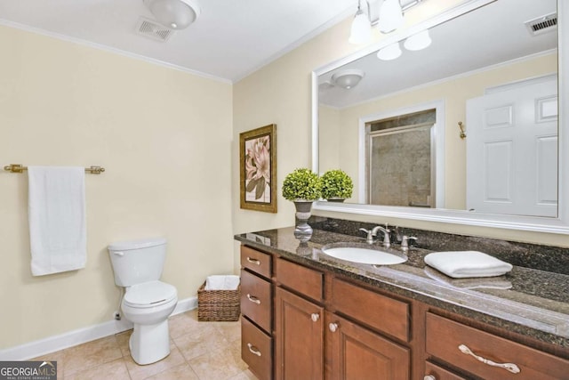 bathroom with tile patterned flooring, vanity, ornamental molding, toilet, and walk in shower