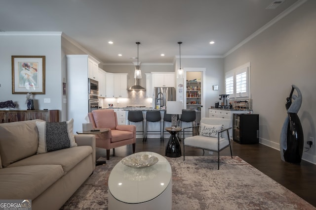 living room featuring dark wood-type flooring and ornamental molding