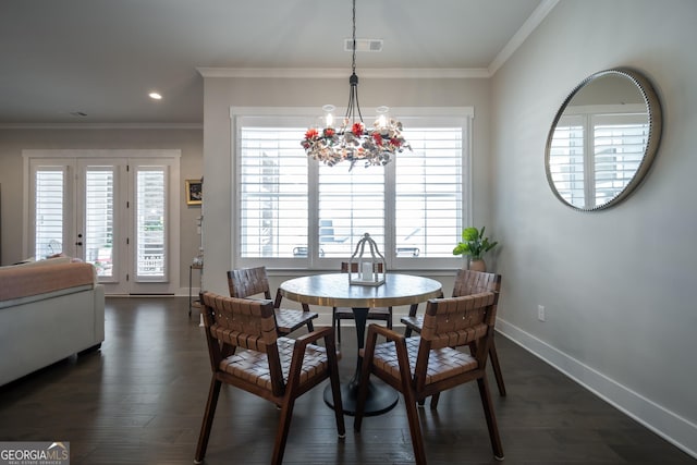 dining room featuring an inviting chandelier, crown molding, and dark wood-type flooring