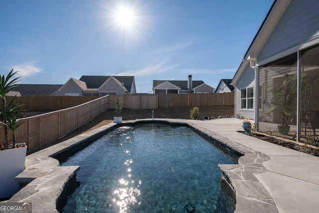 view of swimming pool with a patio