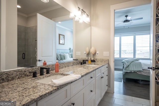 bathroom with ornamental molding, vanity, and walk in shower