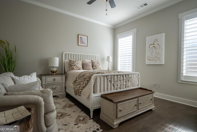 bedroom featuring ornamental molding, dark hardwood / wood-style floors, and ceiling fan