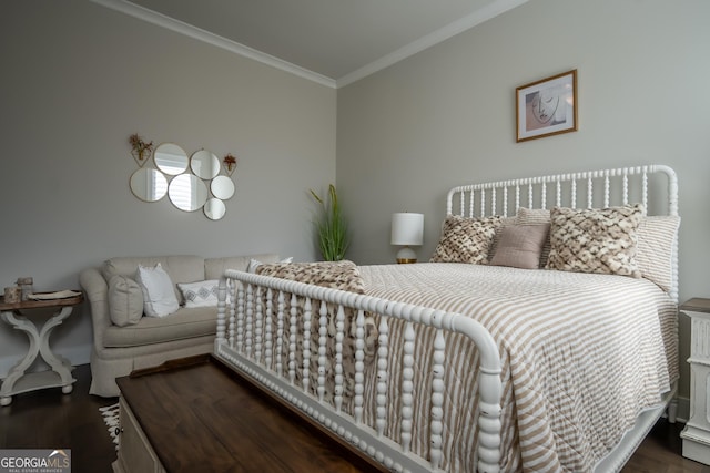 bedroom with crown molding and dark hardwood / wood-style floors