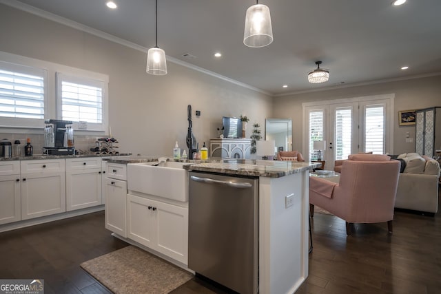 kitchen featuring dishwasher, light stone counters, and decorative light fixtures