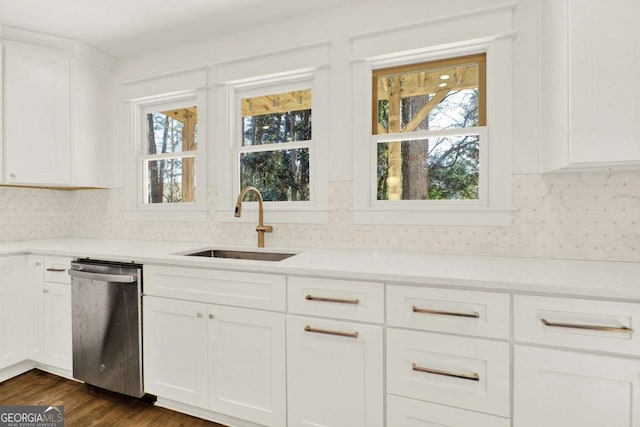 kitchen featuring white cabinetry, dishwasher, sink, decorative backsplash, and dark wood-type flooring