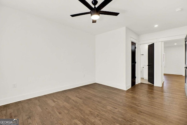 unfurnished room featuring dark hardwood / wood-style flooring and ceiling fan