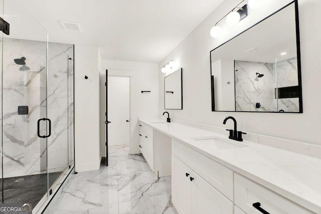 bathroom with vanity and a shower with door