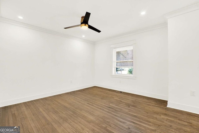 empty room with crown molding, ceiling fan, and dark hardwood / wood-style floors