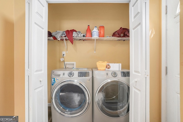 laundry room featuring separate washer and dryer