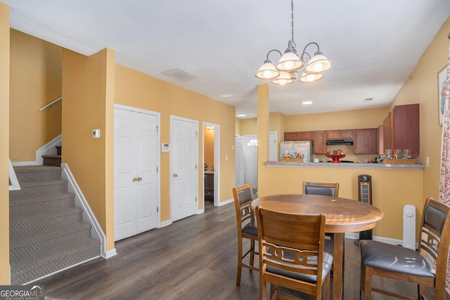 dining room featuring dark hardwood / wood-style flooring