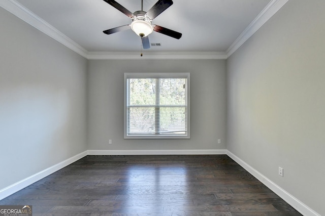 empty room with ornamental molding, ceiling fan, and dark hardwood / wood-style flooring