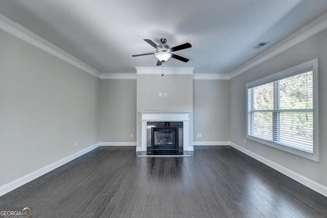 unfurnished living room featuring dark hardwood / wood-style flooring, crown molding, a high end fireplace, and ceiling fan