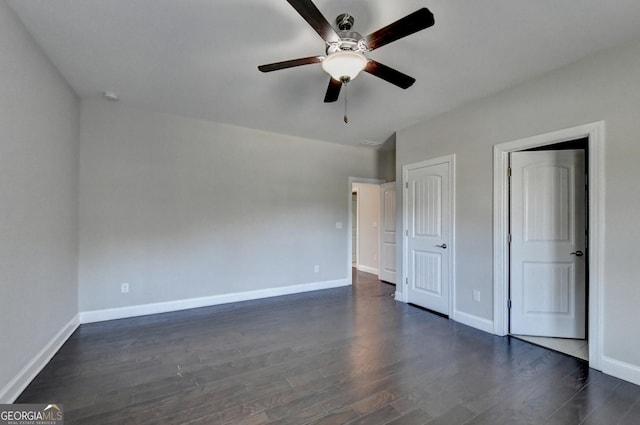 unfurnished bedroom featuring dark hardwood / wood-style floors and ceiling fan