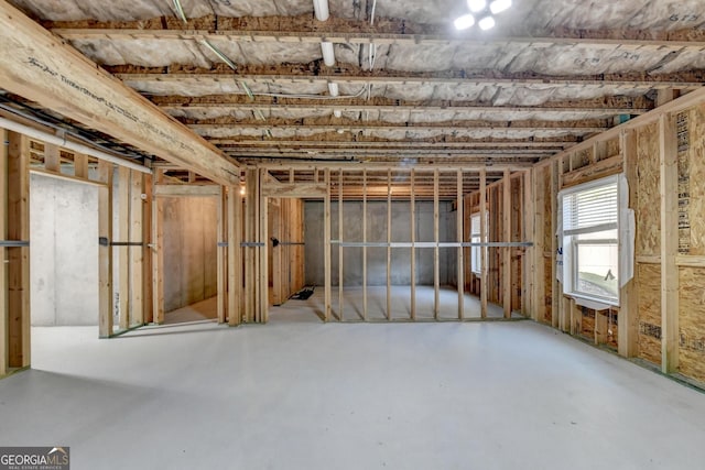 misc room with concrete flooring