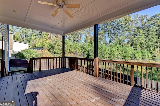 wooden terrace featuring ceiling fan