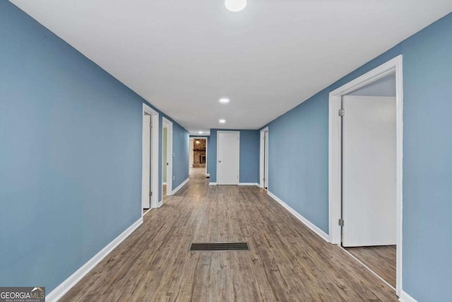 hallway featuring hardwood / wood-style floors