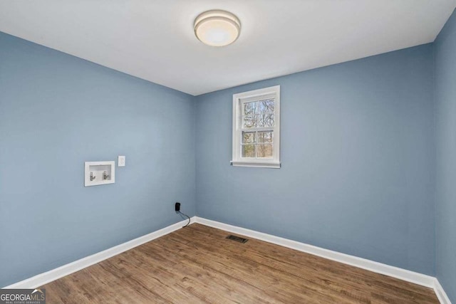 washroom featuring washer hookup and hardwood / wood-style floors