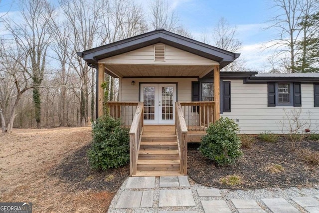 view of front facade featuring french doors and a porch