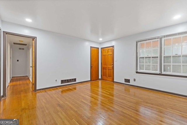 empty room featuring hardwood / wood-style flooring