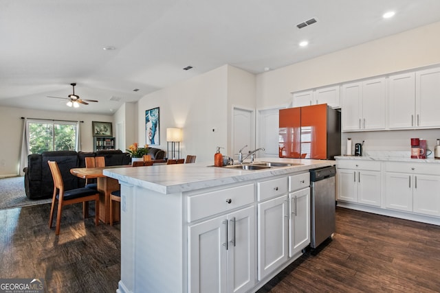 kitchen featuring sink, white cabinetry, a kitchen island with sink, dark hardwood / wood-style flooring, and stainless steel dishwasher