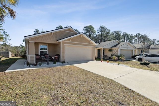 ranch-style home featuring a garage and a front yard