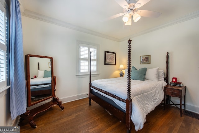 bedroom with crown molding, ceiling fan, and dark hardwood / wood-style flooring